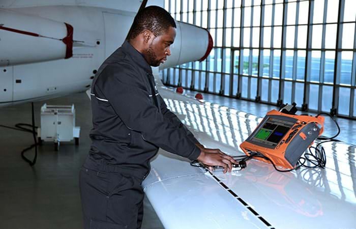 Technician using NDT tool