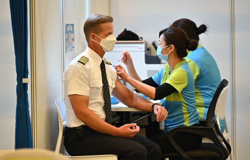 Cathay Pacific pilot getting vaccinated