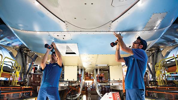 technicians working on fuselage