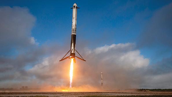 USSF-44 mission launch with Falcon Heavy side boosters touch down