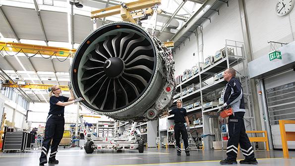 Lufthansa Technik technician with engine