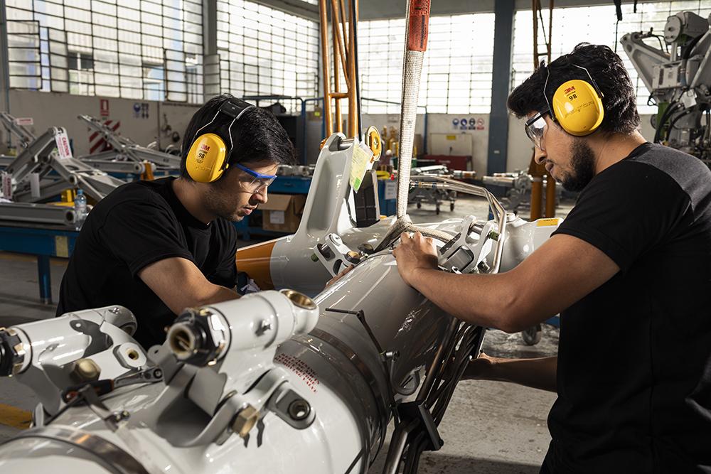 Technicians working on a landing gear