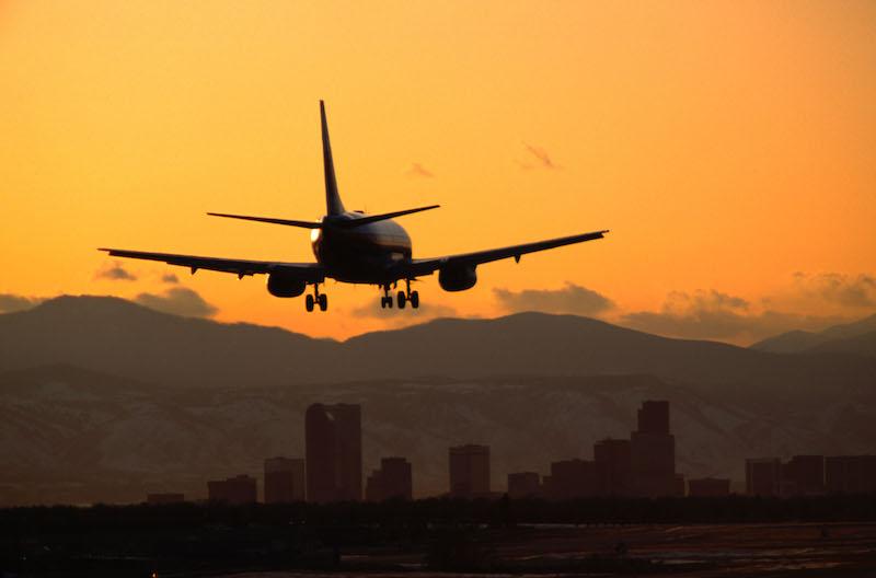 plane landing at sunset