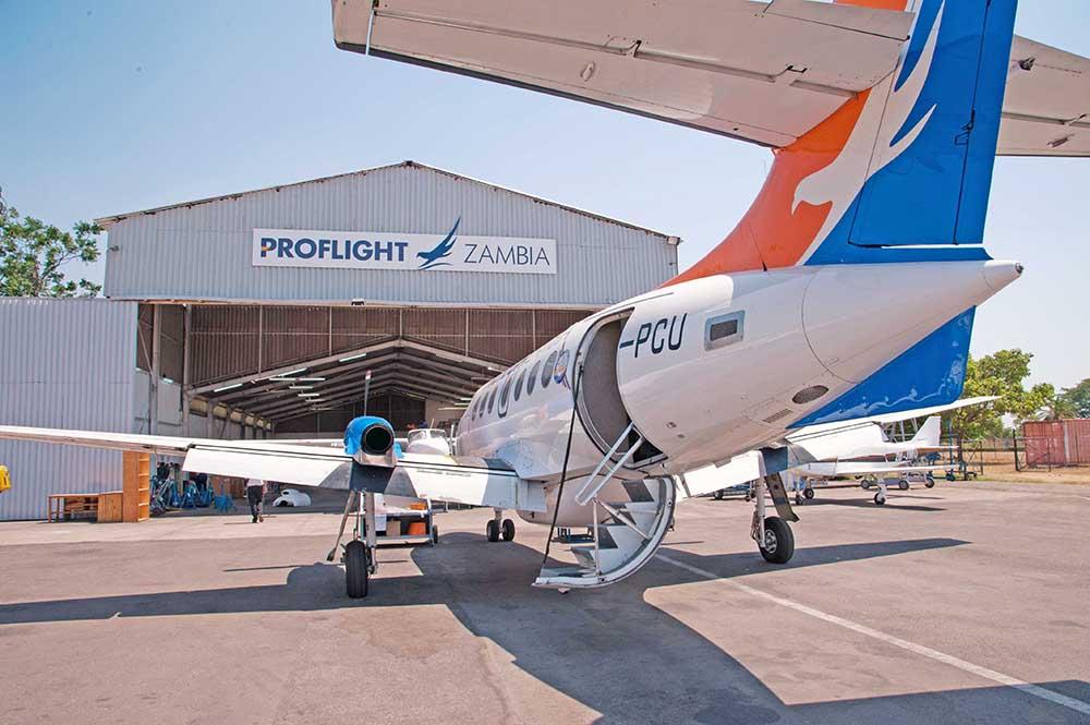 Aircraft in front of hangar