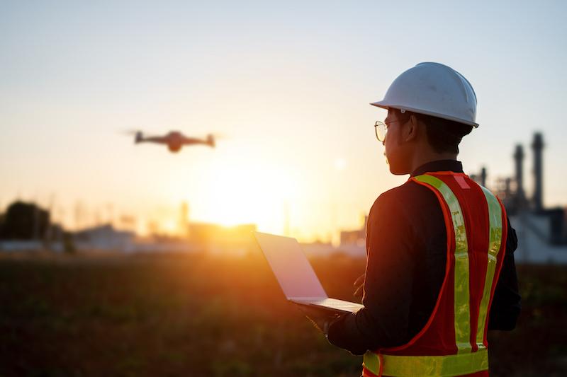 person working on flying drone