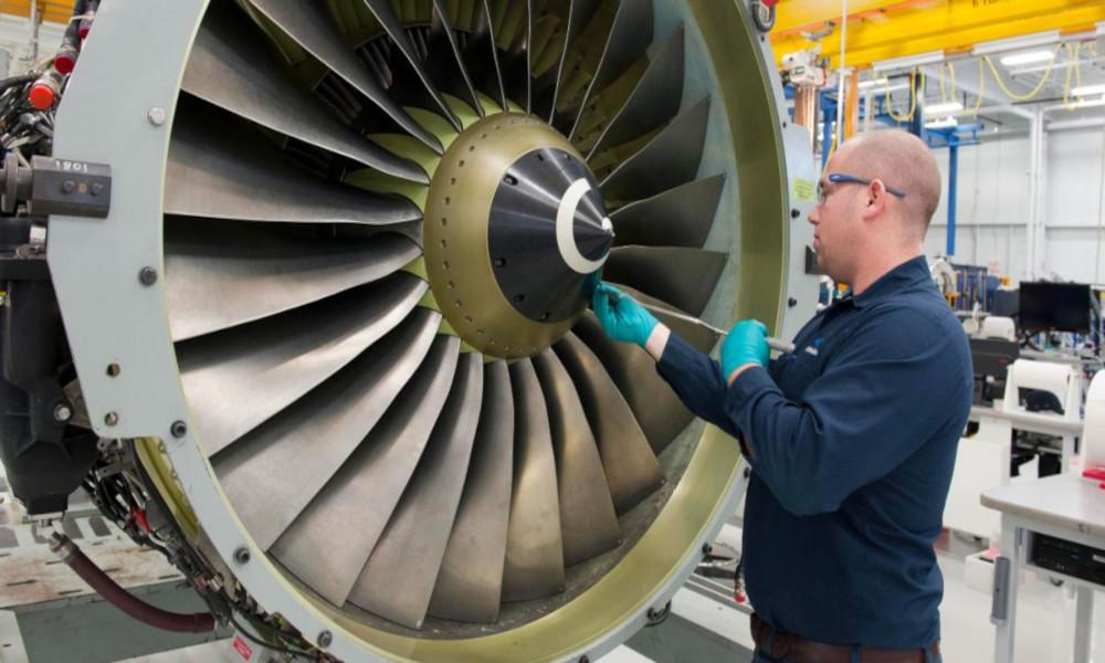 Technician working on engine