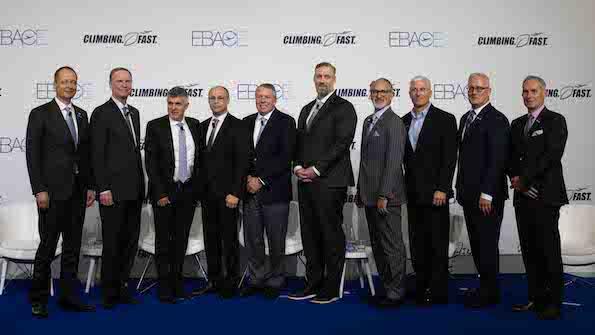 business aviation oem leaders posed for photograph in front of EBACE 2024 screen