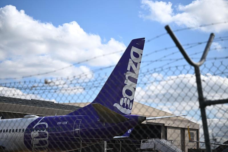 bonza tail fin behind barbed wire