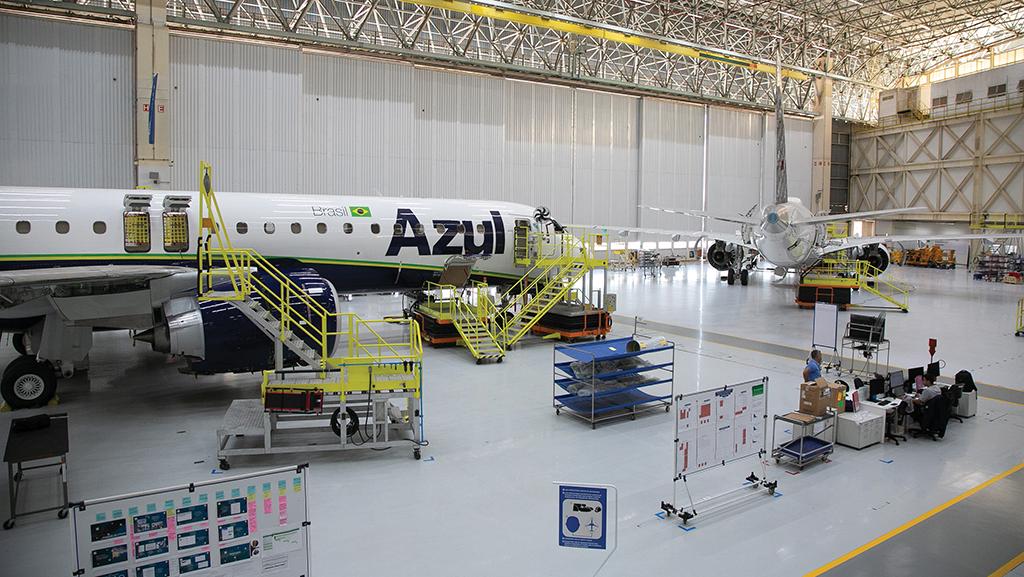 Two Embraer jets in facility, one with Azul livery