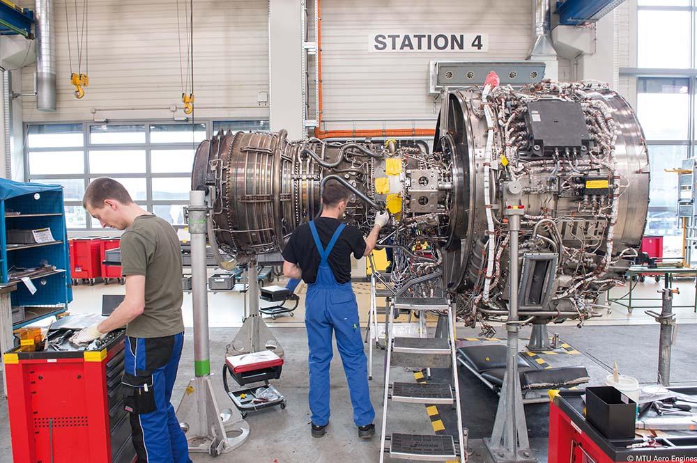 Technicians working on V2500 engine