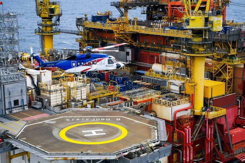 A Bristow operated Sikorsky S-92 lifts from a Norwegian oil rig in the North Sea.