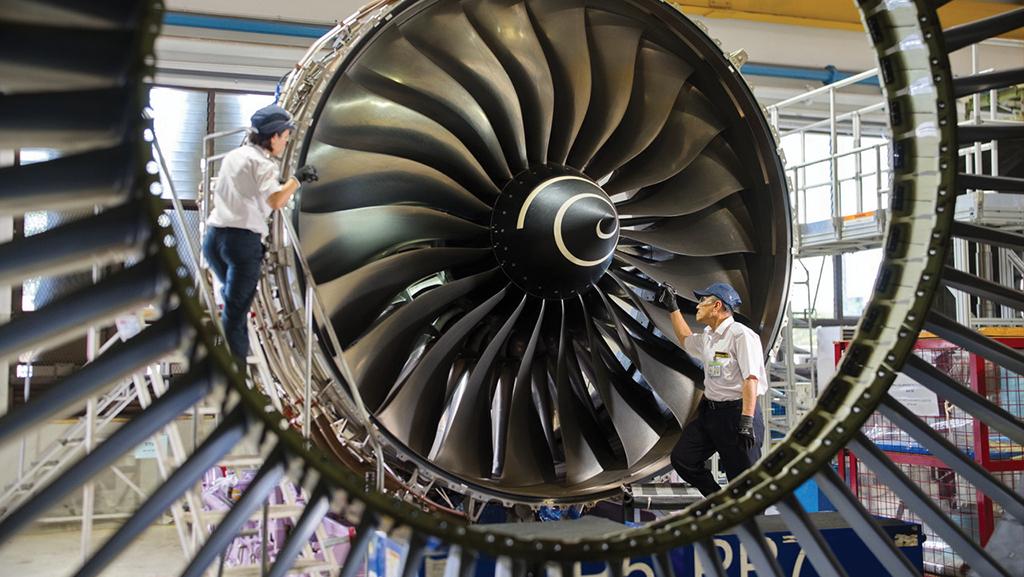 SIAEC technicians examine engine