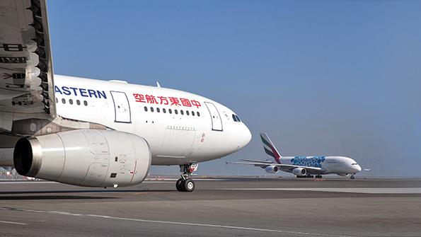 Side view of two aircraft on runway