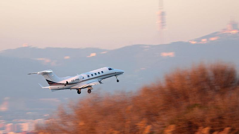 Embraer Phenom 300 in flight