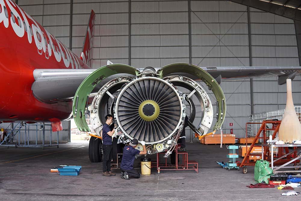 ADE technicians working on engine