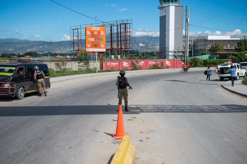  Police officers patrol near the Toussaint Louverture International Airport in Port-au-Prince, Haiti