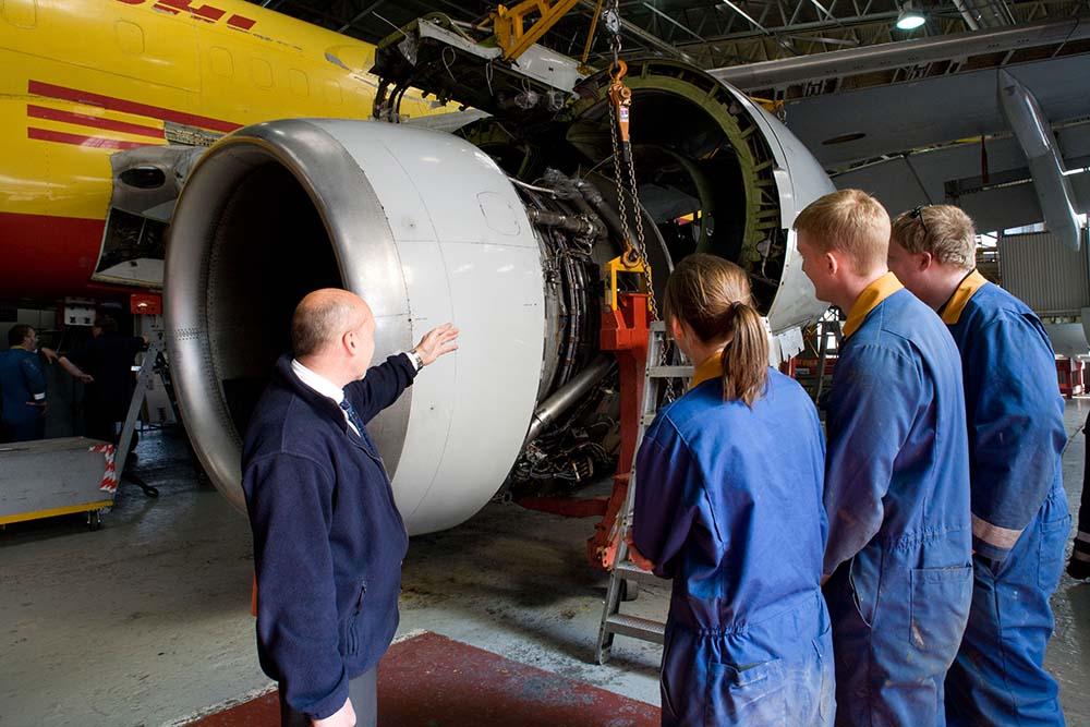 Aviation maintenance instructor with students