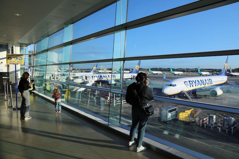 Passengers wait to board Ryanair low cost airline aircraft at Dublin Airport, Ireland