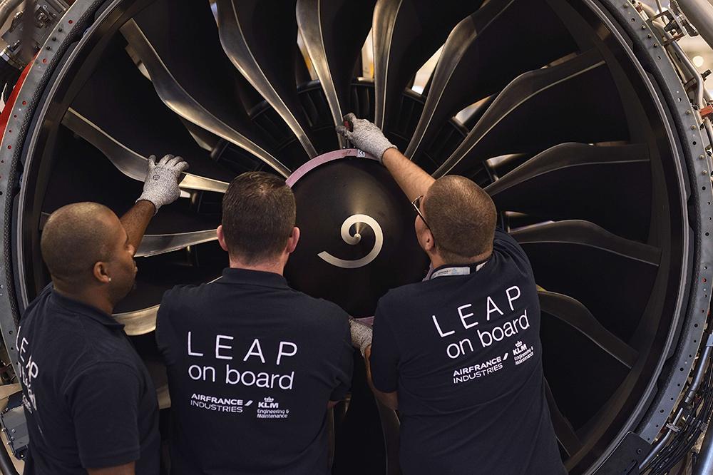 AFI KLM E&M technicians working on CFM Leap engine