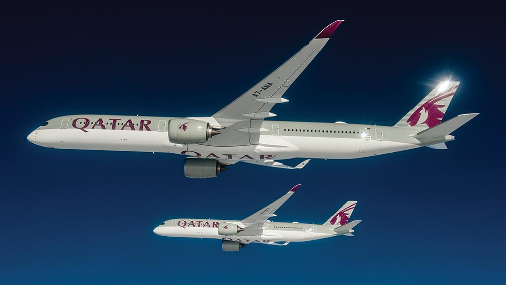 Two Qatar Airways Airbus A350s in air