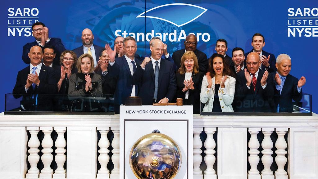 StandardAero employees applauding as CEO Russell Ford rings opening bell at New York Stock Exchange