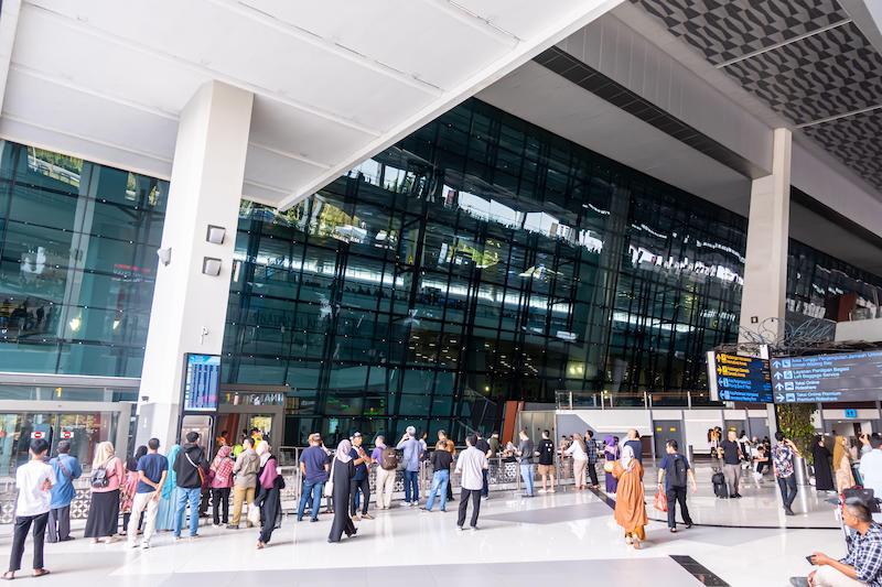 Tourists outside, exterior of CGK Soekarno–Hatta International Airport Jakarta Indonesia