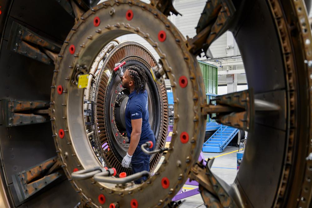 A technician works on an engine at AFI KLM E&M's Paris-Orly engine shop.