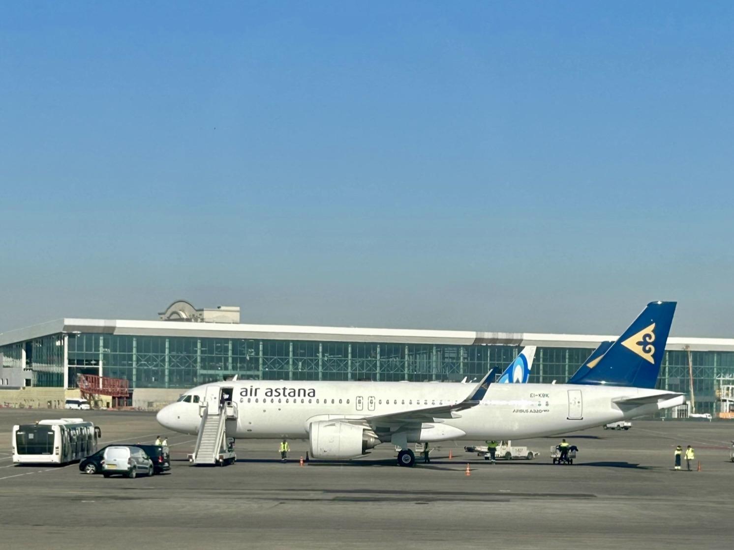 An Air Astana Airbus A320neo sits at Almaty International Airport.