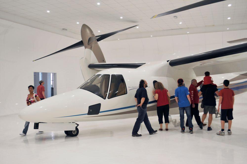 AW 609 tiltrotor (former BA 609 tilt rotor) plane and visitors, Volandia fly museum, Somma Lombardo, Malpensa, Lombardy, Italy Contributor: luciopix / Alamy Stock Photo