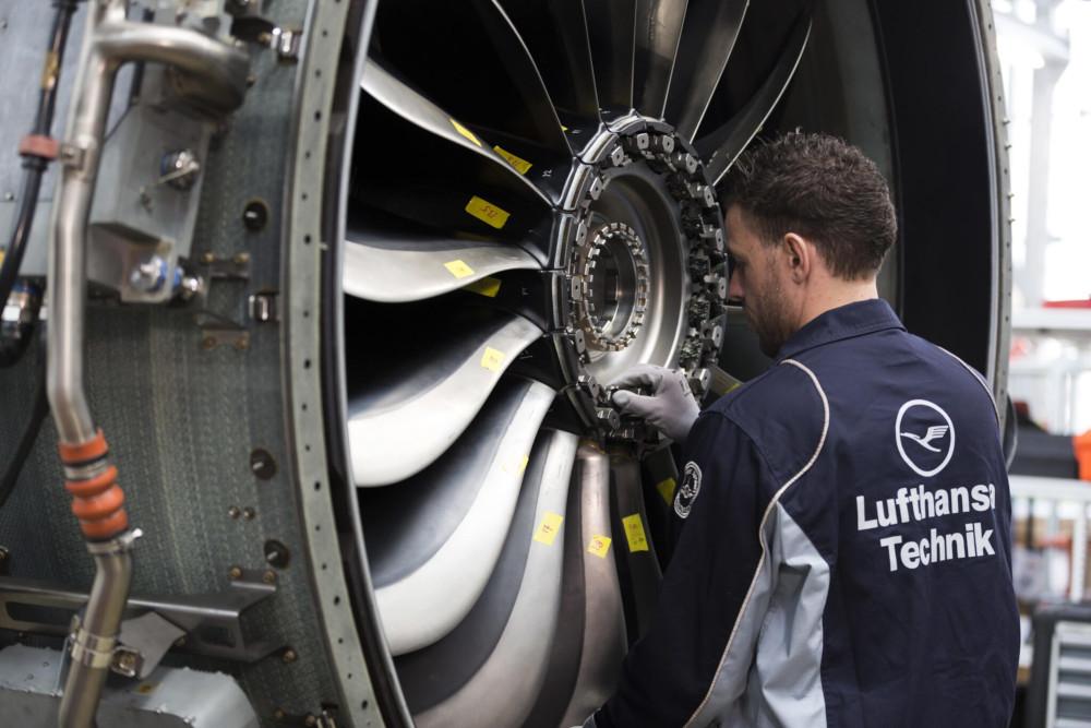 Lufthansa Technik technician inspecting at Leap 1B engine at its overhaul shop in Hamburg.