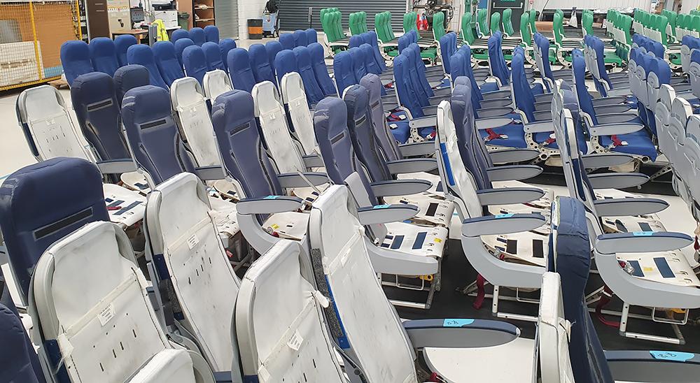 Removed aircraft seats in hangar