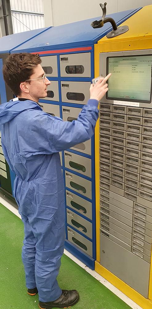 Technician in front of vending machine