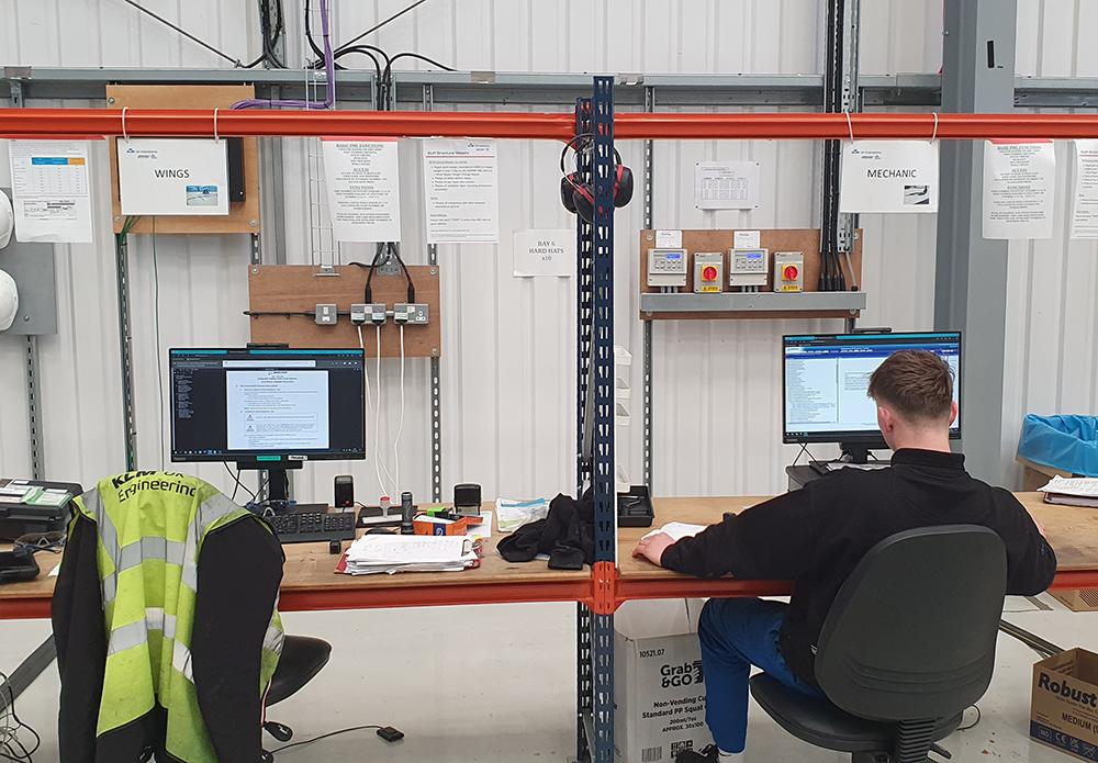 Technician in front of computer