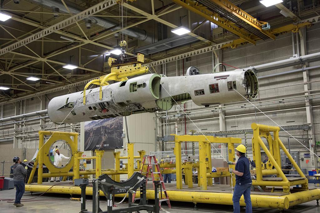 workers rebuilding aircraft