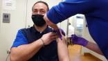 United Airlines ramp services worker receives COVID-19 vaccine