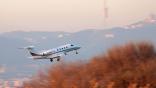 Embraer Phenom 300 in flight