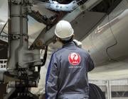 Japan Airlines tech working on Aircraft